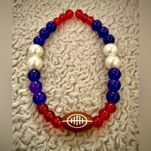 Great bracelet for football fans. It features, red, white, blue and a football.